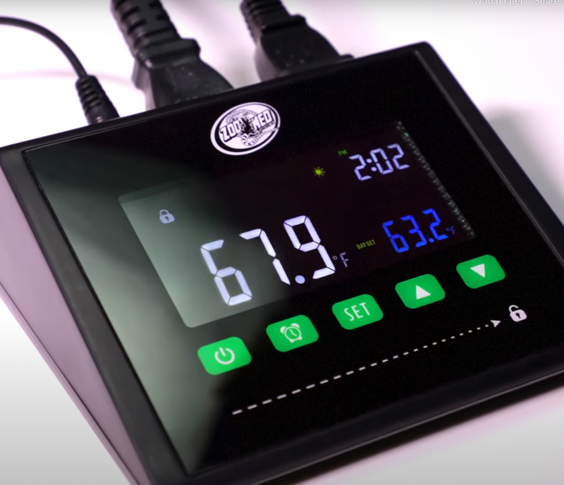 Digital temperature controller with display and control buttons on a white background